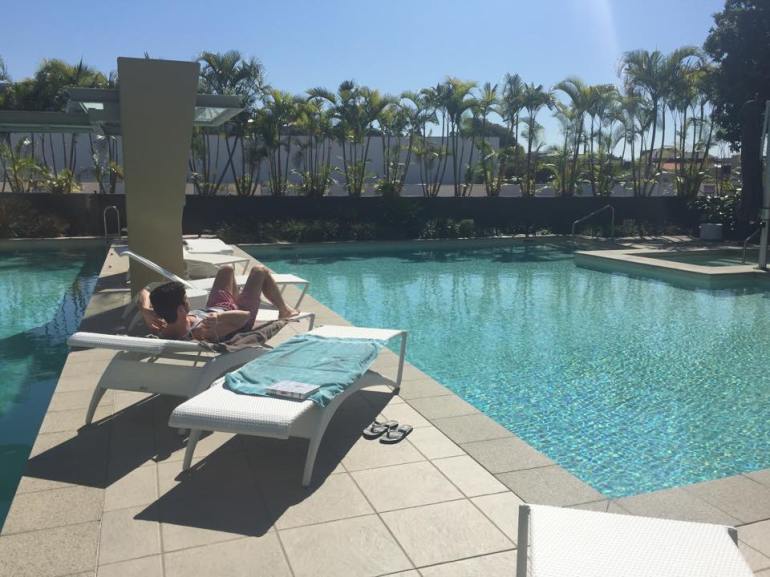 Taking it easy by the pool that's part of our apartment building - which is often empty on weekdays! =D